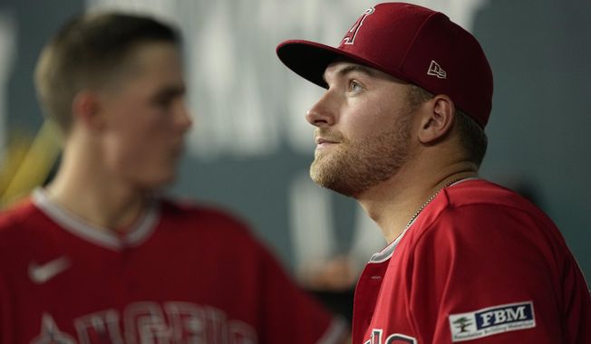 Los Angeles Angels&#x27; Reid Detmers stands in the dugout before the eighth inning of a baseball game against the Texas Rangers, Wednesday, Aug. 16, 2023, in Arlington, Texas. (AP Photo/Tony Gutierrez)