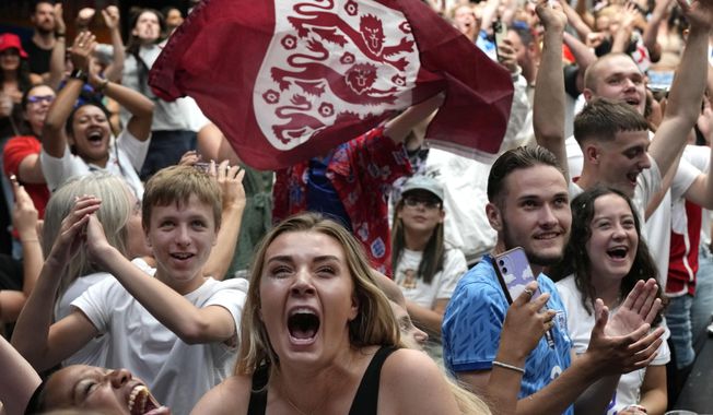 England fans react as England win their match, as they watch a screening of the Women&#x27;s World Cup 2023 semifinal soccer match between England and Australia at BOXPARK Wembley in London, Wednesday, Aug. 16, 2023. England will play Spain in the final of the Women&#x27;s World Cup on Sunday after beating co-hosts Australia 3-1 in the semi-final in Sydney.(AP Photo/Frank Augstein)