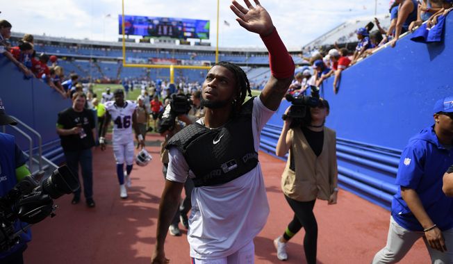 Buffalo Bills safety Damar Hamlin waves to fans after an NFL preseason football game against the Indianapolis Colts in Orchard Park, N.Y., Saturday, Aug. 12, 2023. (AP Photo/Adrian Kraus)