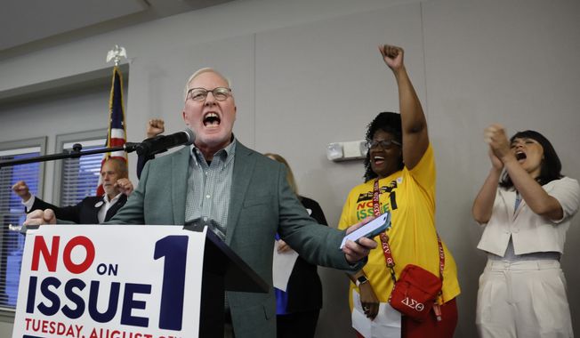 Dennis Willard, spokesperson for One Person One Vote, celebrates the results of the election during a watch party Tuesday, Aug. 8, 2023, in Columbus, Ohio. Ohio voters have resoundingly rejected a Republican-backed measure that would have made it more difficult to pass abortion protections. (AP Photo/Jay LaPrete)