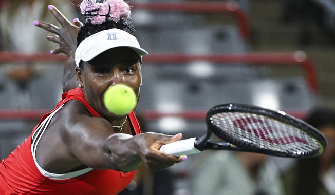 Venus Williams, of the United States, keeps her eyes on the ball during her women&#x27;s first-round match against Madison Keys, also of the United States, at the National Bank Open tennis tournament in Montreal, Monday, Aug. 7, 2023. (Graham Hughes/The Canadian Press via AP)