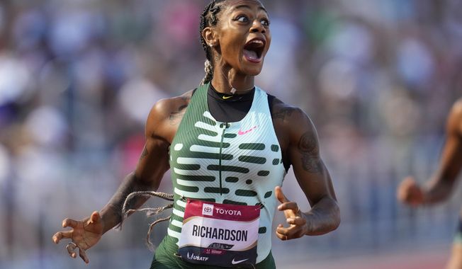 FILE - Sha&#x27;Carri Richardson reacts as she wins her heat in the first round of the women&#x27;s 200 meters during the U.S. track and field championships in Eugene, Ore., Saturday, July 8, 2023. (AP Photo/Ashley Landis, File)