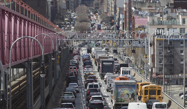 In this March 28, 2019, file photo, traffic makes its way into Manhattan from Brooklyn over the Williamsburg Bridge in New York. (AP Photo/Mary Altaffer)