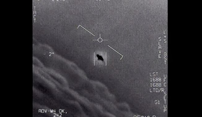 The image from video provided by the Department of Defense shows an unexplained object as it is tracked high in the clouds, traveling against the wind. There&#x27;s a whole fleet of them, one naval aviator tells another, though only one indistinct object is shown. It&#x27;s rotating.&quot; The U.S. government has been taking a hard look at unidentified flying objects, under orders from Congress, and an official report was released in June 2021. (Department of Defense via AP)