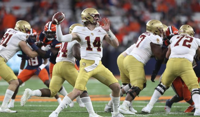 Boston College quarterback Emmett Morehead (14) throws a pass during the first half of the team&#x27;s NCAA college football game against Syracuse in Syracuse, N.Y., Oct. 30, 2021. Boston College opens their season at home against Northern Illinois on Sept. 2. (AP Photo/Joshua Bessex, File)