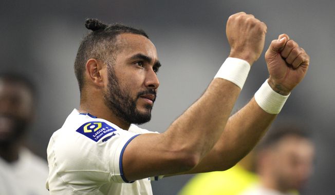 FILE - Marseille&#x27;s Dimitri Payet celebrates his team&#x27;s victory in the French League One soccer match against Lyon, at the Velodrome stadium in Marseille, southern France, Nov. 6, 2022. The 36-year-old midfielder, who arrived in Rio de Janeiro, Wednesday, Aug. 16, 2023, is expected to sign a deal with the Brazilian club Vasco da Gama. (AP Photo/Daniel Cole, File)