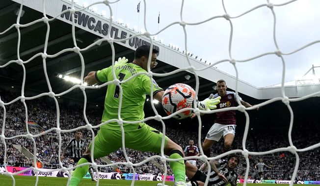 Newcastle United&#x27;s Sandro Tonali, right, scores their side&#x27;s first goal of the game during the Premier League soccer match between Newcastle United and Aston Villa at St. James&#x27; Park, Newcastle upon Tyne, England, Saturday Aug. 12, 2023. (Owen Humphreys/PA via AP)