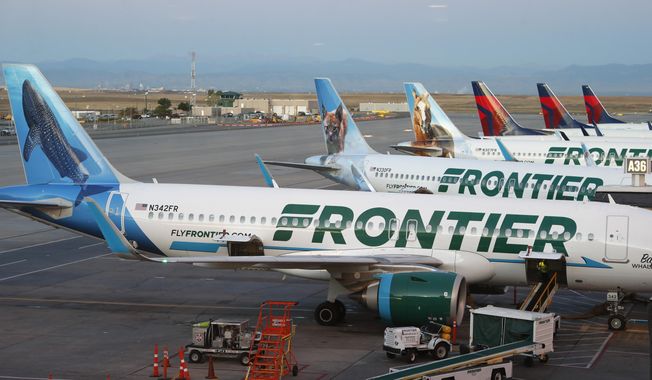 Frontier Airlines jets sit at gates at Denver International Airport on Sept. 22, 2019, in Denver. (AP Photo/David Zalubowski, File)