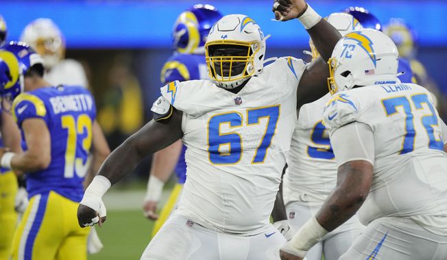 Los Angeles Chargers defensive tackle CJ Okoye reacts after sacking Los Angeles Rams quarterback Stetson Bennett during the second half of a preseason NFL football game Saturday, Aug. 12, 2023, in Inglewood, Calif. (AP Photo/Mark J. Terrill)
