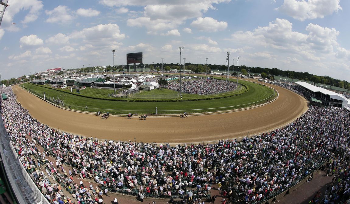Fans watch a race before the 141st running of the Kentucky Derby horse race at Churchill Downs in Louisville, Ky., May 2, 2015. Racing will resume at Churchill Downs in September 2023 with no changes being made after a review of surfaces and safety protocols in the wake of 12 horse deaths, including seven in the days leading up to the Kentucky Derby in May. (AP Photo/Charlie Riedel, File)