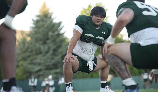 Colorado State defensive lineman Hidetora Hanada warms up takes part in drills during the team&#x27;s NCAA college football practice on the university&#x27;s campus Tuesday, Aug. 8, 2023, in Fort Collins, Colo. Back in Japan, the 6-foot-1, 280-pound Hanada rose to the highest amateur ranks of sumo wrestling by refusing to be pushed around in the ring. He&#x27;s taking that same approach to the football field as he learns the ropes of being a run stuffer/pass rusher for the Rams. (AP Photo/Koji Ueda) (AP Photo/David Zalubowski)