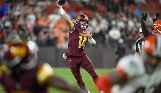 Washington Commanders quarterback Sam Howell passes against the Cleveland Browns during the first half of a preseason NFL football game on Friday, Aug. 11, 2023, in Cleveland. (AP Photo/Sue Ogrocki)