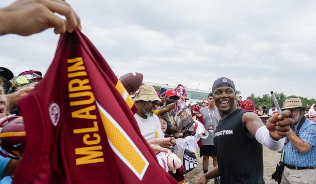 Washington Commanders wide receiver Terry McLaurin smiles as he greets fans after an NFL football practice at the team&#x27;s training facility, Thursday, July 27, 2023, in Ashburn, Va. (AP Photo/Alex Brandon)