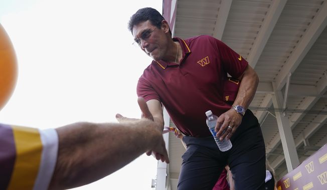Washington Commanders head coach Ron Rivera greets fans at an NFL football pep rally at FedEx Field in Landover, Md., Friday, July 21, 2023. (AP Photo/Stephanie Scarbrough) **FILE**