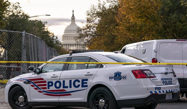 Washington Metropolitan Police investigate near the Supreme Court and Capitol after reports of a suspicious vehicle in which two men and a woman were detained with guns, in Washington, Oct. 19, 2022. The head of the D.C. Council said Monday, March 6, 2023, that he is withdrawing the capital city’s new criminal code from consideration, just before a U.S. Senate vote that seemed likely to overturn the measure. But it&#x27;s unclear if the action will prevent the vote or spare President Joe Biden a politically charged decision on whether to endorse the congressional action. (AP Photo/J. Scott Applewhite, File)