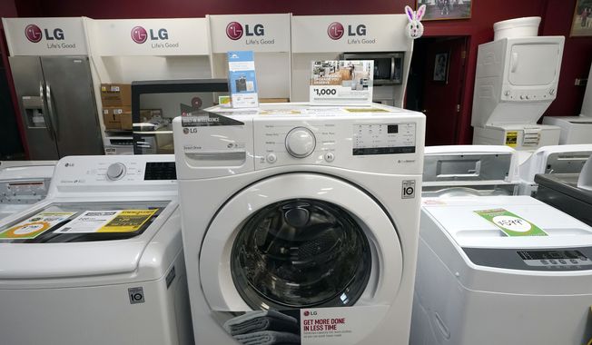 Washing machines are displayed at Sam&#x27;s Appliances TV &amp; Furniture, on March 25, 2021, in Norwood, Mass. (AP Photo/Steven Senne, File)