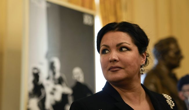FILE - Russian soprano Anna Netrebko answers reporters&#x27; questions prior to the start of a news conference to present Giuseppe Verdi&#x27;s &#x27;Macbeth&#x27;, directed by Italian conductor Riccardo Chailly, who will open the opera season at the La Scala opera house, in Milan, Italy, on Nov. 29, 2021. A scheduled performance by Russian opera singer Anna Netrebko in the Czech capital has been canceled, officials said on Thursday, Aug. 17, 2023. The announcement came after the Prague government said on Monday that all its coalition parties opposed the concert at a time Russia wages war on Ukraine. (AP Photo/Luca Bruno, File)