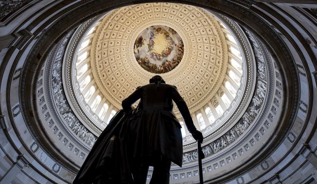 The Rotunda of the U.S. Capitol Building is seen with a statue of George Washington in the foreground, in Washington, Wednesday, May 17, 2023. (AP Photo/J. Scott Applewhite) ** FILE **