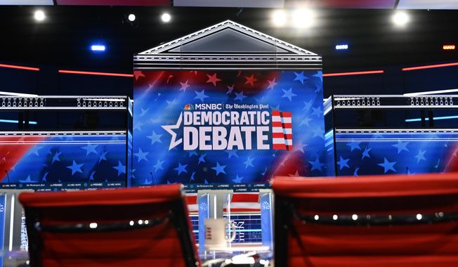 In this Nov. 19, 2019, file photo, an Atlanta stage gets prepared for a 2020 Democratic presidential primary debate. (AP Photo/Mike Stewart) ** FILE **