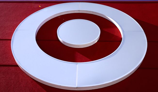 The bullseye logo on a Target store is shown in the South Bay neighborhood of Boston, on Feb. 28, 2022. Target reports earnings on Wednesday. (AP Photo/Charles Krupa, File)