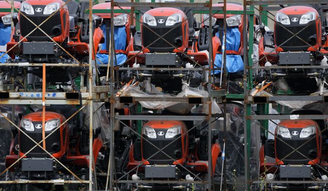 Kubota tractors are stored in Uniontown, Pa., Friday, June 9, 2023. On Thursday, the Commerce Department issues its first of three estimates of how the U.S. economy performed in the second quarter of 2023. (AP Photo/Gene J. Puskar) ** FILE **