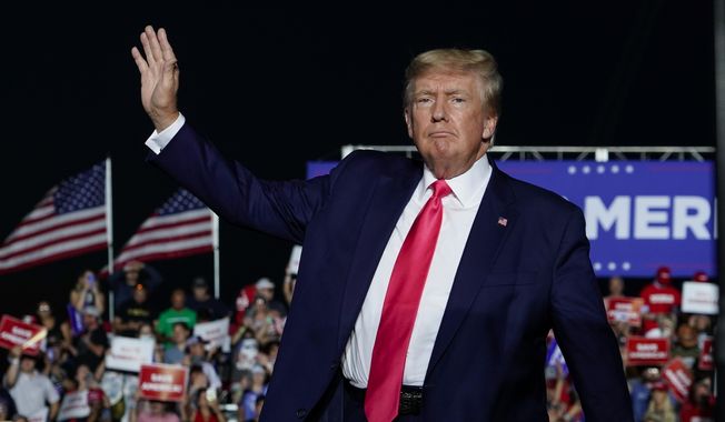 Former President Donald Trump arrives at a rally, Aug. 5, 2022, in Waukesha, Wis. A Wisconsin judge on Thursday, Aug. 10, 2023 allowed a civil lawsuit filed against 10 fake electors for former President Trump and two of his attorneys to proceed, rejecting a move to dismiss the case. (AP Photo/Morry Gash, File)