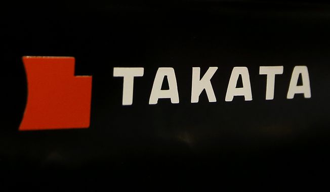 The logo of Takata Corp. is displayed at an auto supply shop in Tokyo, July 6, 2016. In a document posted Tuesday, Aug. 1, 2023, General Motors announced it is recalling nearly 900 vehicles in the U.S. and Canada with Takata air bag inflators that could explode and hurl shrapnel in a crash. (AP Photo/Shizuo Kambayashi, File)
