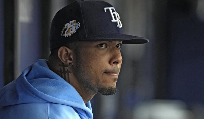 Tampa Bay Rays&#x27; Wander Franco watches from the dugout during the fifth inning of a baseball game against the Cleveland Guardians Sunday, Aug. 13, 2023, in St. Petersburg, Fla. (AP Photo/Chris O&#x27;Meara) **FILE**