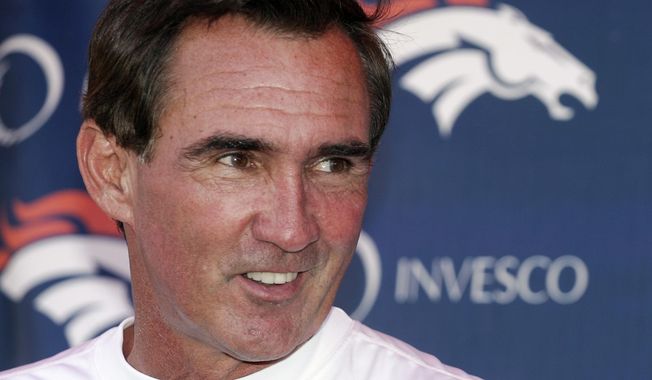 Denver Broncos head coach Mike Shanahan laughs as he talks to the media following the morning session of football training camp in Denver, Sunday, July 29, 2007. Versatile running back Roger Craig, and two-time Super Bowl-winning coaches Tom Coughlin and Mike Shanahan advanced to the next stage of consideration for the Pro Football Hall of Fame. The selection committees cut down the list of candidates from 31 seniors and 29 coaches and contributors to 12 in each category in results announced Thursday, July 27, 2023. (AP Photo/Jack Dempsey, File)