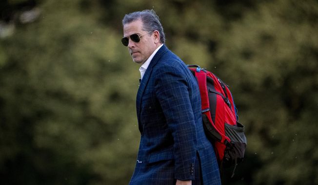 Hunter Biden, the son of President Joe Biden, walks from Marine One upon arrival at Fort McNair, June 25, 2023, in Washington. Hunter Biden is expected to appear before a federal judge Wednesday, July 26 to plead guilty to two tax crimes and admit to possessing a gun as a drug user in a deal with the Justice Department that is likely going to spare him time behind bars. (AP Photo/Andrew Harnik)