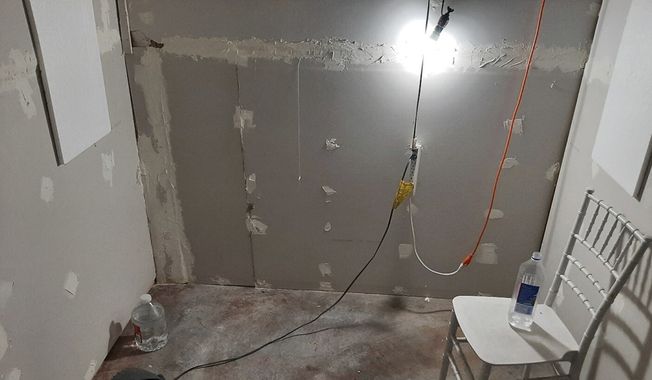 This undated photo provided by the Federal Bureau of Investigation&#x27;s Portland Field Office shows the interior of a makeshift cinderblock cell in Klamath Falls, Ore., allegedly used by Negasi Zuberi. The FBI said Wednesday, Aug. 2, 2023, that Zuberi, 29, who posed as an undercover police officer kidnapped a woman in Seattle, drove her hundreds of miles to his home in Oregon, and kept her in the cell from which she eventually escaped and found help. Zuberi who was arrested faces a federal interstate kidnapping charge, and authorities said they are looking for additional victims after linking him to sexual assaults in at least four more states. (FBI via AP)