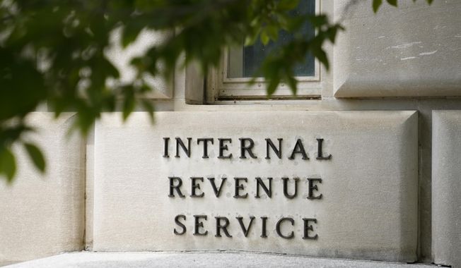 A sign outside the Internal Revenue Service building in Washington, on May 4, 2021. Effective immediately, the Internal Revenue Service will end its decades-old policy of making unannounced home and business visits — in a nod to worker safety and combatting scammers who pose as IRS agents. (AP Photo/Patrick Semansky, File)