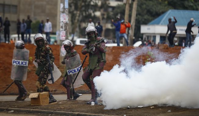 FILE - Riot police fire tear gas grenades at demonstrators during protests in the capital Nairobi, Kenya on July 7, 2023. The United States is praising Kenya&#x27;s interest in leading a multinational force in Haiti. But weeks ago, the U.S. openly warned Kenyan police officers against violent abuses. Now 1,000 of those police officers might head to Haiti to take on gang warfare. (AP Photo/Brian Inganga, File)