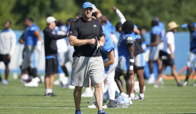 Detroit Lions head coach Dan Campbell observes during an NFL football practice, Wednesday, Aug. 16, 2023, in Allen Park, Mich. (AP Photo/Carlos Osorio)