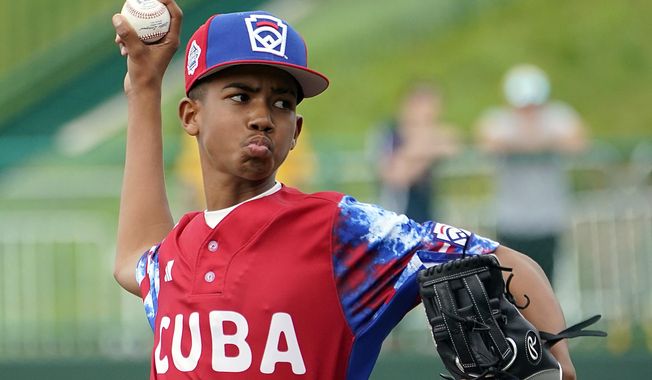 Cuba starting pitcher Luis Gurriel (14) throws to a Japan batter during the first inning of a baseball game at the Little League World Series tournament in South Williamsport, Pa., Wednesday, Aug. 16, 2023. Japan won 1-0. (AP Photo/Tom E. Puskar)