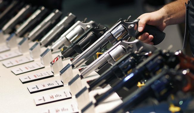 In this Jan. 19, 2016, file photo, handguns are displayed at the Smith &amp; Wesson booth at the Shooting, Hunting and Outdoor Trade Show in Las Vegas. The Mexican government sued U.S. gun manufacturers and distributors, including some of the biggest names in guns like Smith &amp;amp; Wesson Brands, on Aug. 4, 2021 in U.S. federal court in Boston, arguing that their commercial practices have unleashed tremendous bloodshed in Mexico. (AP Photo/John Locher, File)