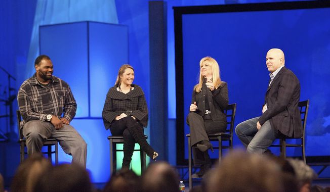 Michael Oher, left, Collins Tuohy, second from left, and Leigh Anne Tuohy, whose lives are portrayed in the Oscar-nominated movie &quot;The Blind Side,&quot; speak with Pastor Kerry Shook, right, March 3, 2010 at Woodlands Church&#x27;s Fellowship Campus in The Woodlands, TX. Michael Oher, the former NFL tackle known for the movie “The Blind Side,” filed a petition Monday, Aug. 14, 2023, in a Tennessee probate court accusing Sean and Leigh Anne Tuohy of lying to him by having him sign papers making them his conservators rather than his adoptive parents nearly two decades ago. (AP Photo/The Courier, Eric S. Swist, File)
