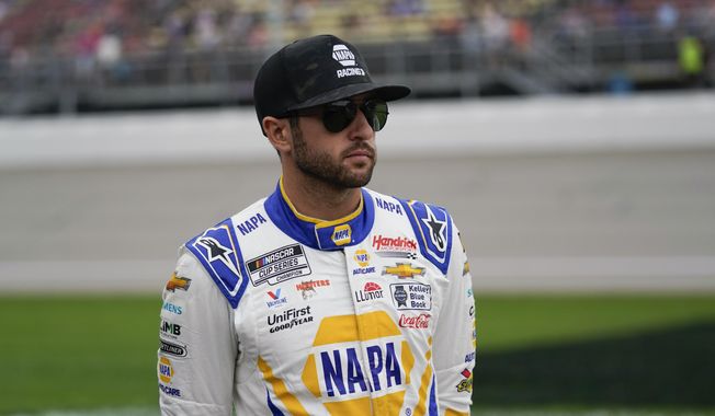 Chase Elliott looks on before a NASCAR Cup Series auto race at Michigan International Speedway in Brooklyn, Mich., Sunday, Aug. 6, 2023. (AP Photo/Paul Sancya) **FILE**