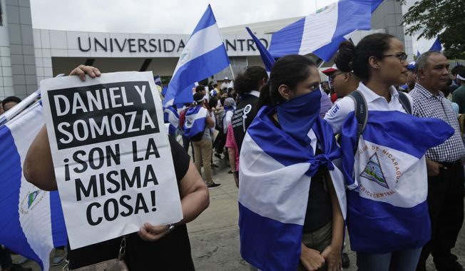 Demonstrators protest outside the Jesuit-run Universidad Centroamericana, UCA, demanding the university&#x27;s allocation of its share of 6% of the national budget in Managua, Nicaragua, Aug. 2, 2018. The Jesuits announced Wednesday, Aug. 16, 2023, that Nicaragua&#x27;s government has confiscated the UCA, one of the region&#x27;s most highly regarded colleges. (AP Photo/Arnulfo Franco, File)