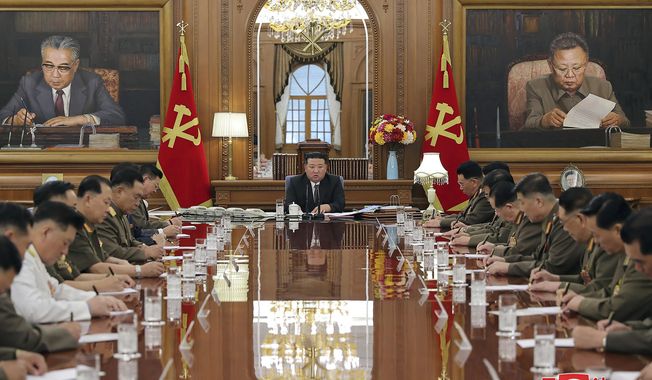 In this undated photo provided by the North Korean government, North Korean leader Kim Jong-un, center, attends a meeting of the North Korean ruling Workers’ Party’s central military commission in Pyongyang, North Korea on Wednesday, Aug. 9, 2023. Independent journalists were not given access to cover the event depicted in this image distributed by the North Korean government. The content of this image is as provided and cannot be independently verified. Korean language watermark on image as provided by source reads: &quot;KCNA&quot; which is the abbreviation for Korean Central News Agency. (Korean Central News Agency/Korea News Service via AP)