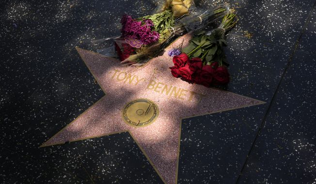Flowers lay atop the Hollywood Walk of Fame star of the late singer Tony Bennett, Friday, July 21, 2023, in Los Angeles. Bennett died Friday at 96, just two weeks short of his birthday. (AP Photo/Chris Pizzello)
