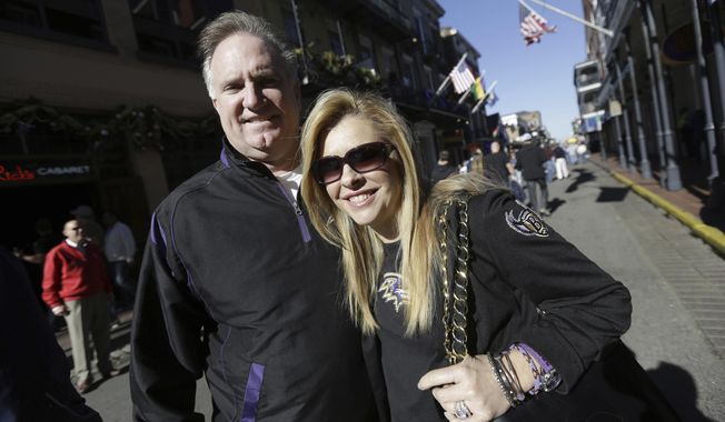 Sean and Leigh Anne Tuohy stand on a street in New Orleans, Feb. 1, 2013. Oher, the former NFL tackle known for the movie “The Blind Side,” filed a petition Monday, Aug. 14, 2023, in a Tennessee probate court accusing Sean and Leigh Anne Tuohy of lying to him by having him sign papers making them his conservators rather than his adoptive parents nearly two decades ago. (AP Photo/Gerald Herbert, File)