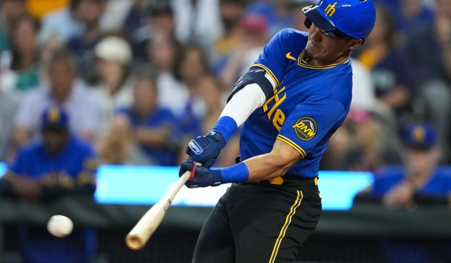 Seattle Mariners&#x27; Josh Rojas hits an RBI single to score Dominic Canzone against the Baltimore Orioles during the fourth inning of a baseball game Friday, Aug. 11, 2023, in Seattle. (AP Photo/Lindsey Wasson)