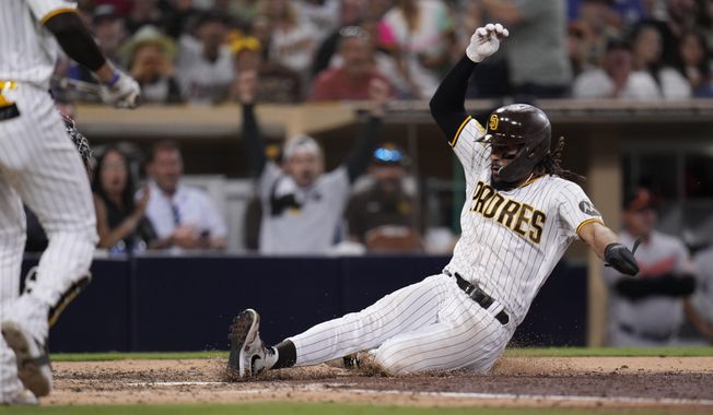 San Diego Padres&#x27; Fernando Tatis Jr. steals home during the seventh inning of a baseball game against the Baltimore Orioles, Wednesday, Aug. 16, 2023, in San Diego. (AP Photo/Gregory Bull)