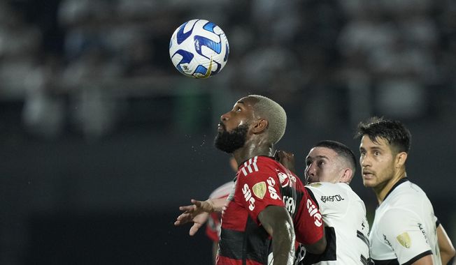 Gerson of Brazil&#x27;s Flamengo eyes the ball during a Copa Libertadores round of 16 second leg soccer match against Paraguay&#x27;s Olimpia at Defensores del Chaco stadium in Asuncion, Paraguay, Thursday, Aug.10, 2023. (AP Photo/Jorge Saenz)