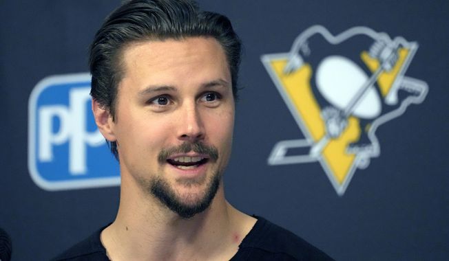 Newly acquired Pittsburgh Penguins defenseman Erik Karlsson holds his first meeting with reporters in Pittsburgh since being traded from the San Jose Sharks, Wednesday, Aug. 9, 2023. (AP Photo/Gene J. Puskar)