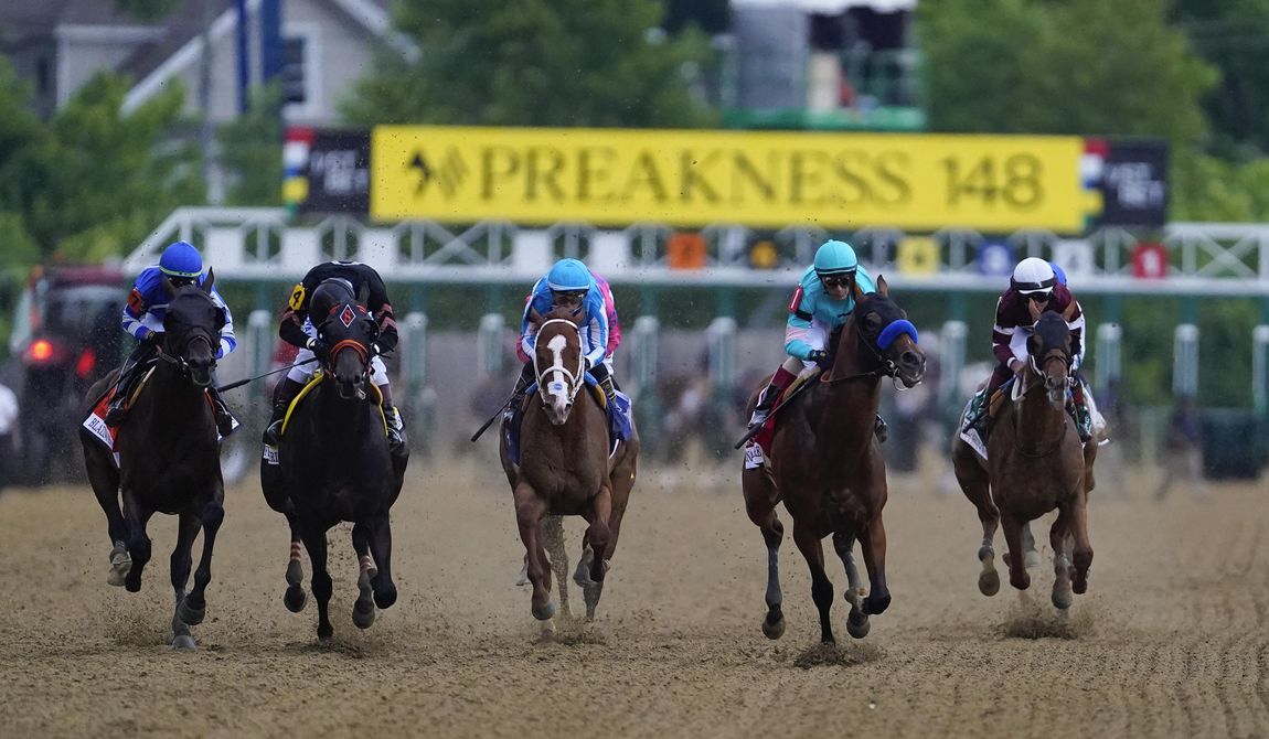 Horses compete during the148th running of the Preakness Stakes horse race at Pimlico Race Course, Saturday, May 20, 2023, in Baltimore. Preakness officials say they are considering moving the second Triple Crown race back to four weeks after the Kentucky Derby instead of two weeks later, which would change the timing that has been in place for more than half a century. Aidan Butler, CEO of 1/ST Racing, which owns and runs Pimlico Race Course in Baltimore where the Preakness is run, said it&#x27;s necessary to take a close look at making changes, citing horse safety among the reasons. (AP Photo/Nick Wass, File)