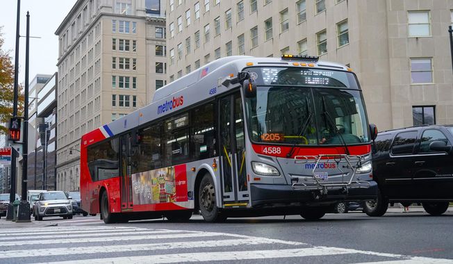 A Metrobus in downtown Washington, Wednesday, Dec. 7, 2022. (AP Photo/Pablo Martinez Monsivais) ** FILE **