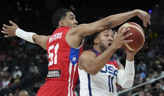 United States&#x27; Jalen Brunson, right, attempts to shoot around Puerto Rico&#x27;s Tremont Waters during the first half of an exhibition basketball game Monday, Aug. 7, 2023, in Las Vegas. (AP Photo/John Locher) **FILE**