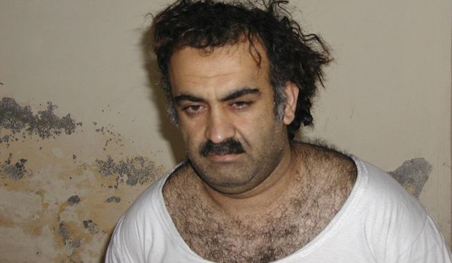 This Saturday March 1, 2003, photo obtained by The Associated Press shows Khalid Shaikh Mohammad, the alleged Sept. 11 mastermind, shortly after his capture during a raid in Pakistan. The suspected architect of the Sept. 11, 2001, attacks and his fellow defendants may never face the death penalty under plea agreements now under consideration to bring an end to their more than decadelong prosecution, the Pentagon and FBI have advised families of some of the thousands killed. (AP Photo)